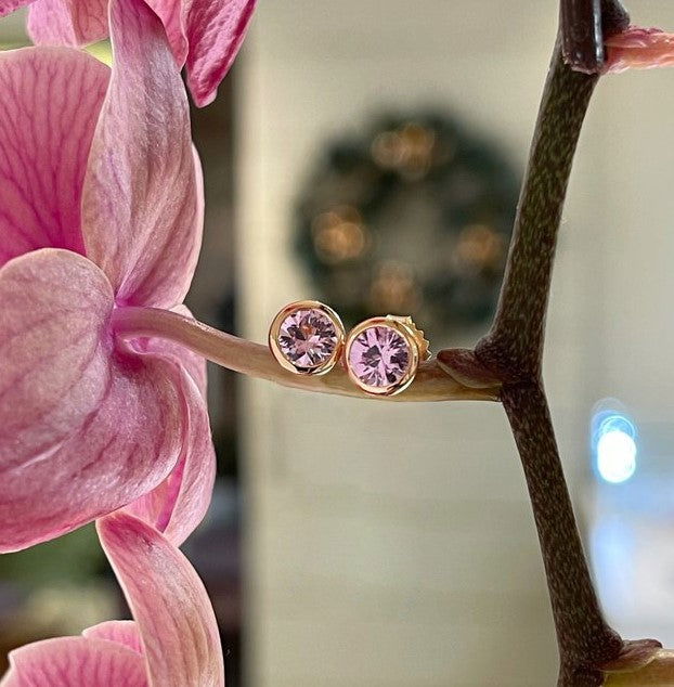 Photo of Plumb Gold Original Tunduru Spinel Studs in a decorative scene, designed by , available at Plumb Gold & Plumb Silver