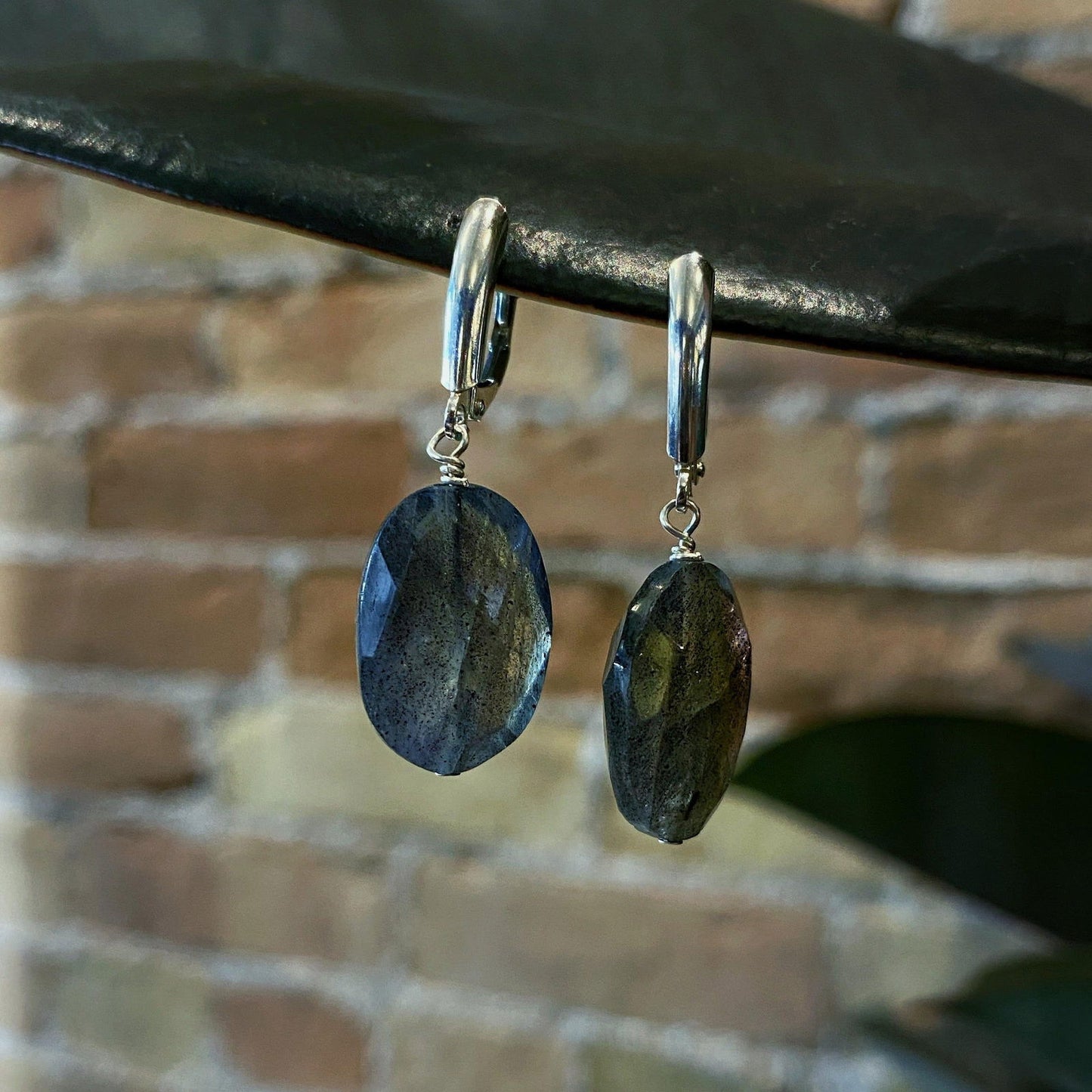 Photo of Plumb Silver Original Labradorite Dangle Earring in a decorative scene, designed by , available at Plumb Gold & Plumb Silver