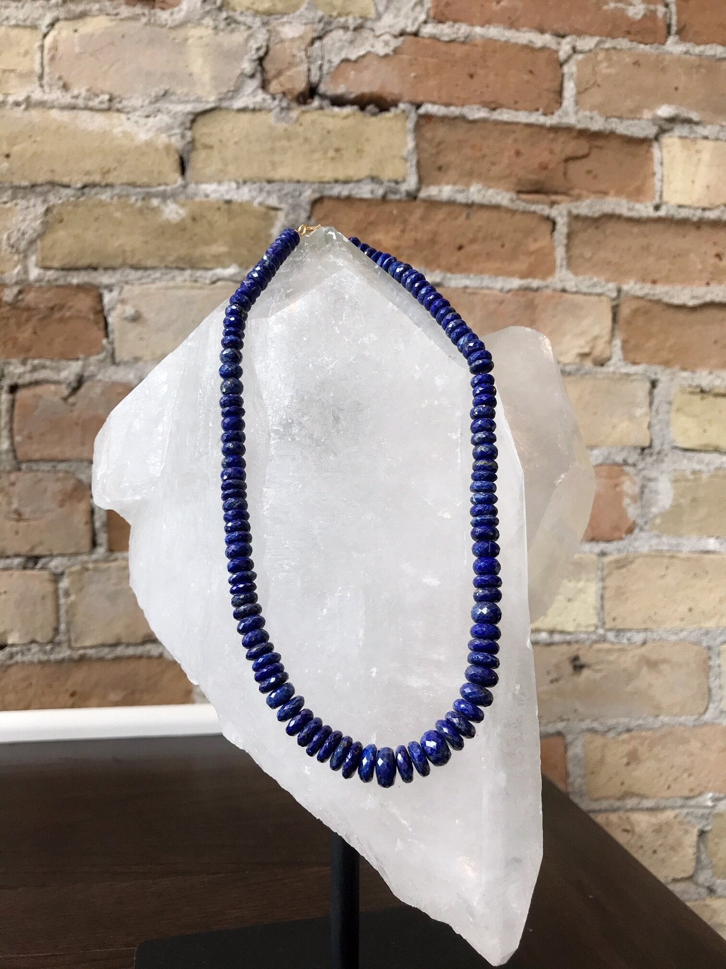 Photo of Plumb Silver Original Lapis Necklace in a decorative scene, designed by , available at Plumb Gold & Plumb Silver