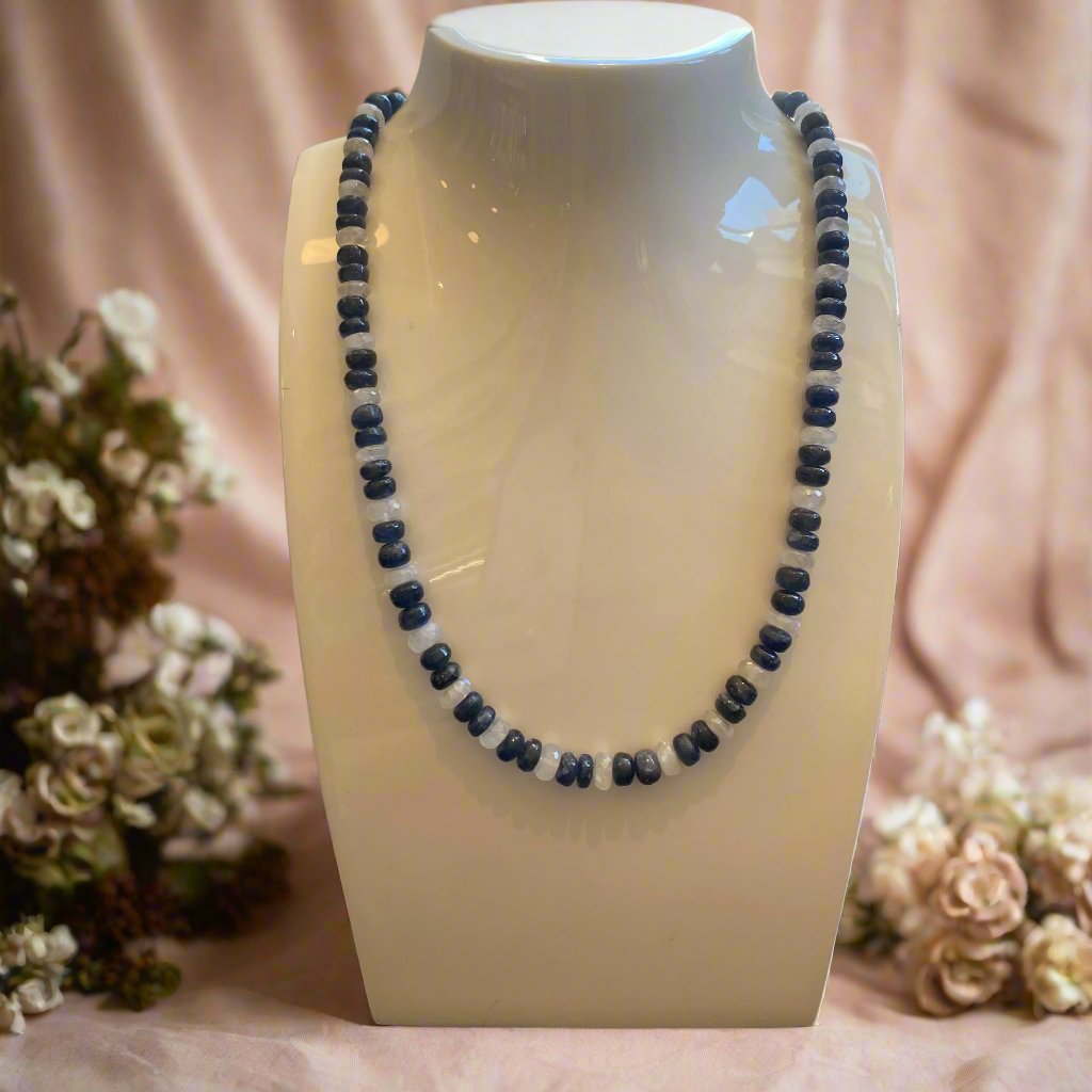 Photo of Plumb Silver Original Sapphire and Moonstone Necklace in a decorative scene, designed by -, available at Plumb Gold & Plumb Silver
