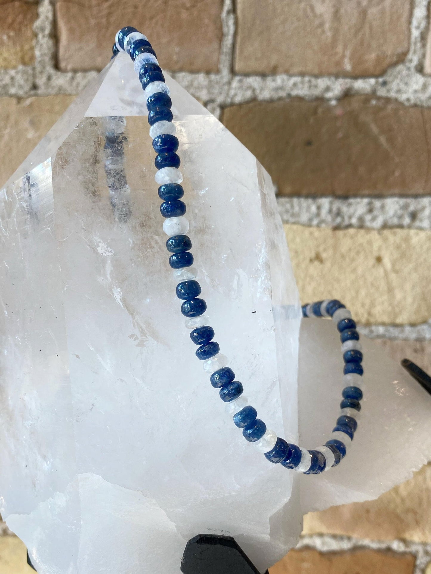 Photo of Plumb Silver Original Sapphire and Moonstone Necklace in a decorative scene, designed by , available at Plumb Gold & Plumb Silver