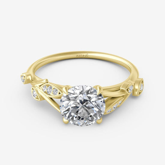 Photo of "Polly" Ring Mounting in a decorative scene, designed by , available at Plumb Gold & Plumb Silver