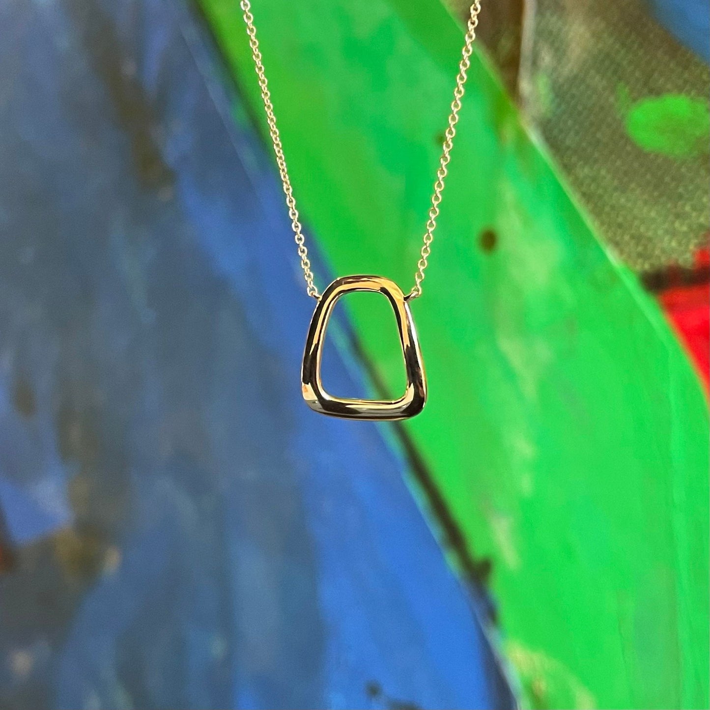 Photo of Prosperity Necklace in a decorative scene, designed by , available at Plumb Gold & Plumb Silver