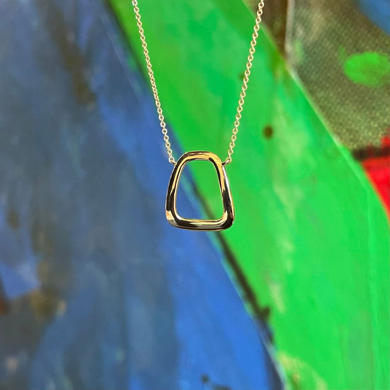 Photo of Prosperity Necklace in a decorative scene, designed by , available at Plumb Gold & Plumb Silver