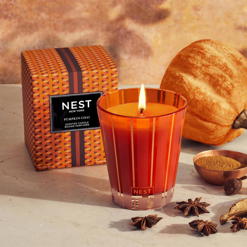 Photo of Pumpkin Chai Candle in a decorative scene, designed by , available at Plumb Gold & Plumb Silver