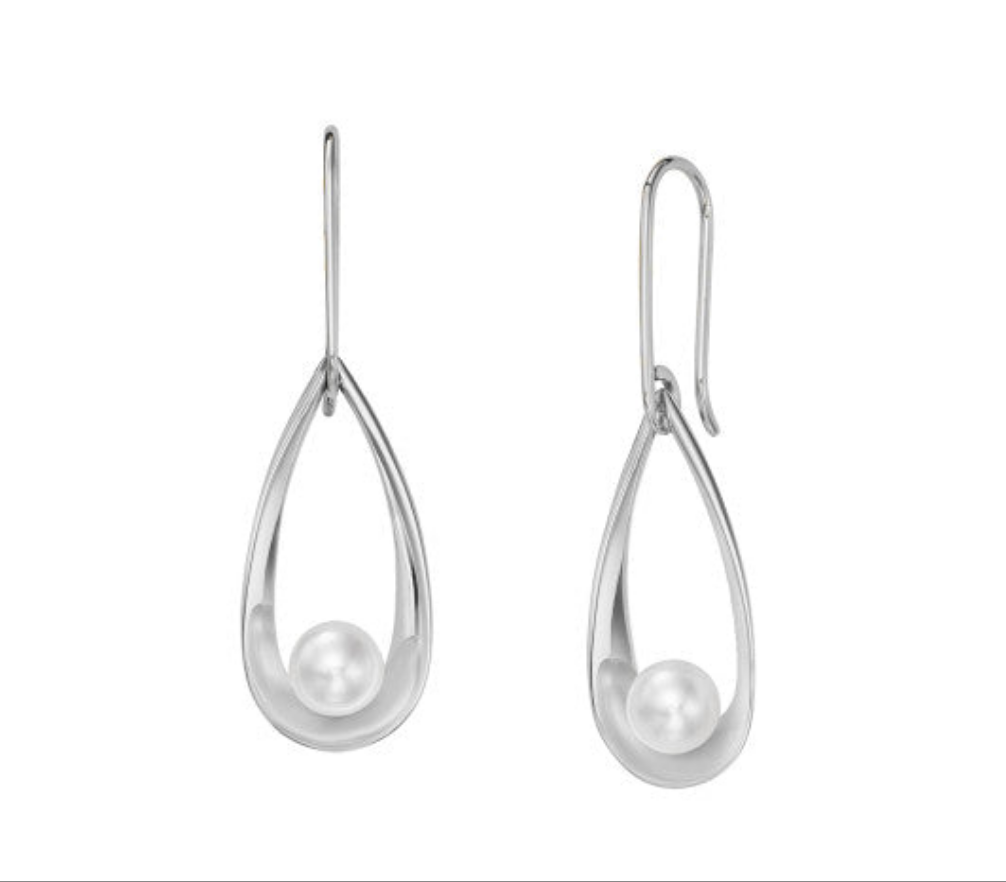 Photo of "Rendezvous" Earring in a decorative scene, designed by , available at Plumb Gold & Plumb Silver