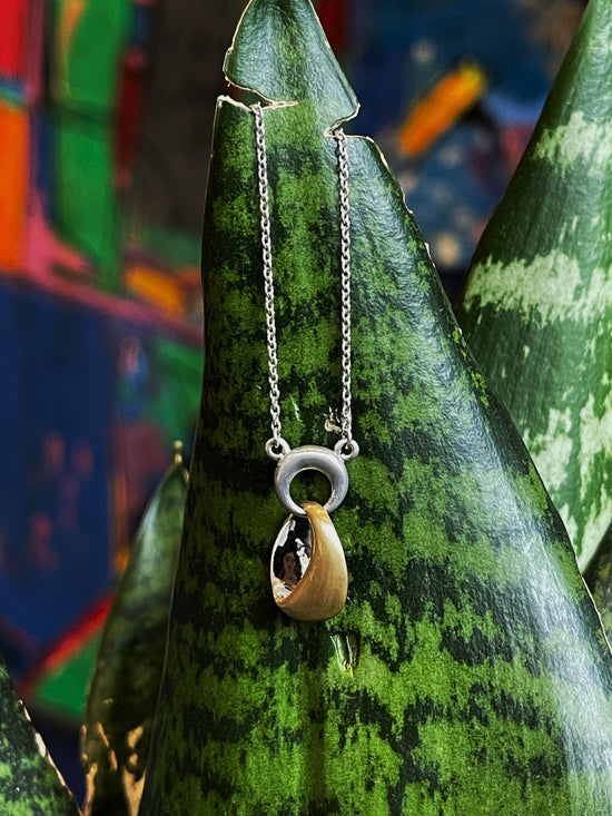 Photo of "Ronda" Necklace in a decorative scene, designed by , available at Plumb Gold & Plumb Silver