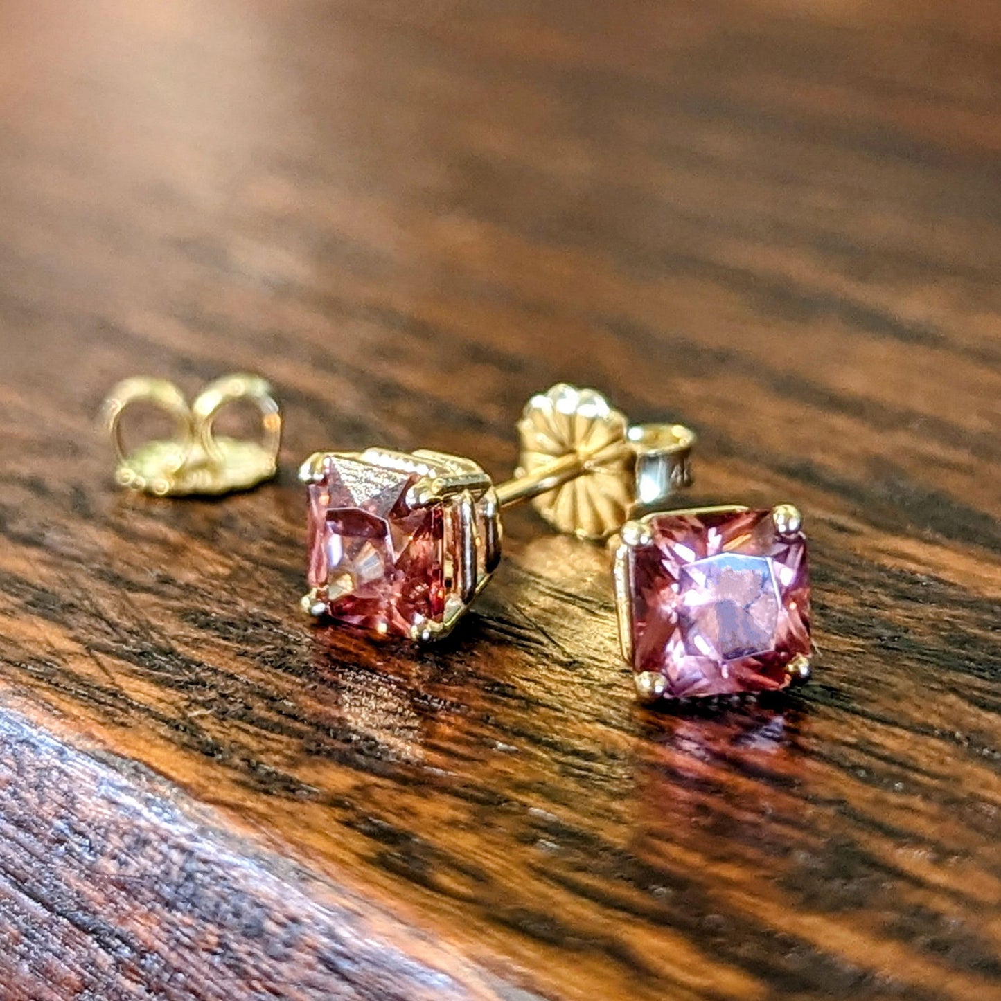 Photo of Rose Zircon Studs in a decorative scene, designed by , available at Plumb Gold & Plumb Silver