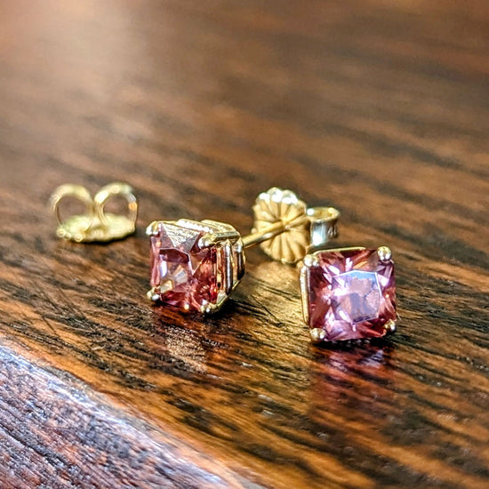 Photo of Rose Zircon Studs in a decorative scene, designed by , available at Plumb Gold & Plumb Silver
