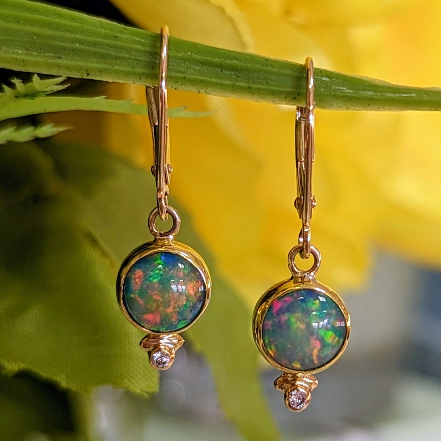 Photo of Round Ethiopian Dangles in a decorative scene, designed by , available at Plumb Gold & Plumb Silver