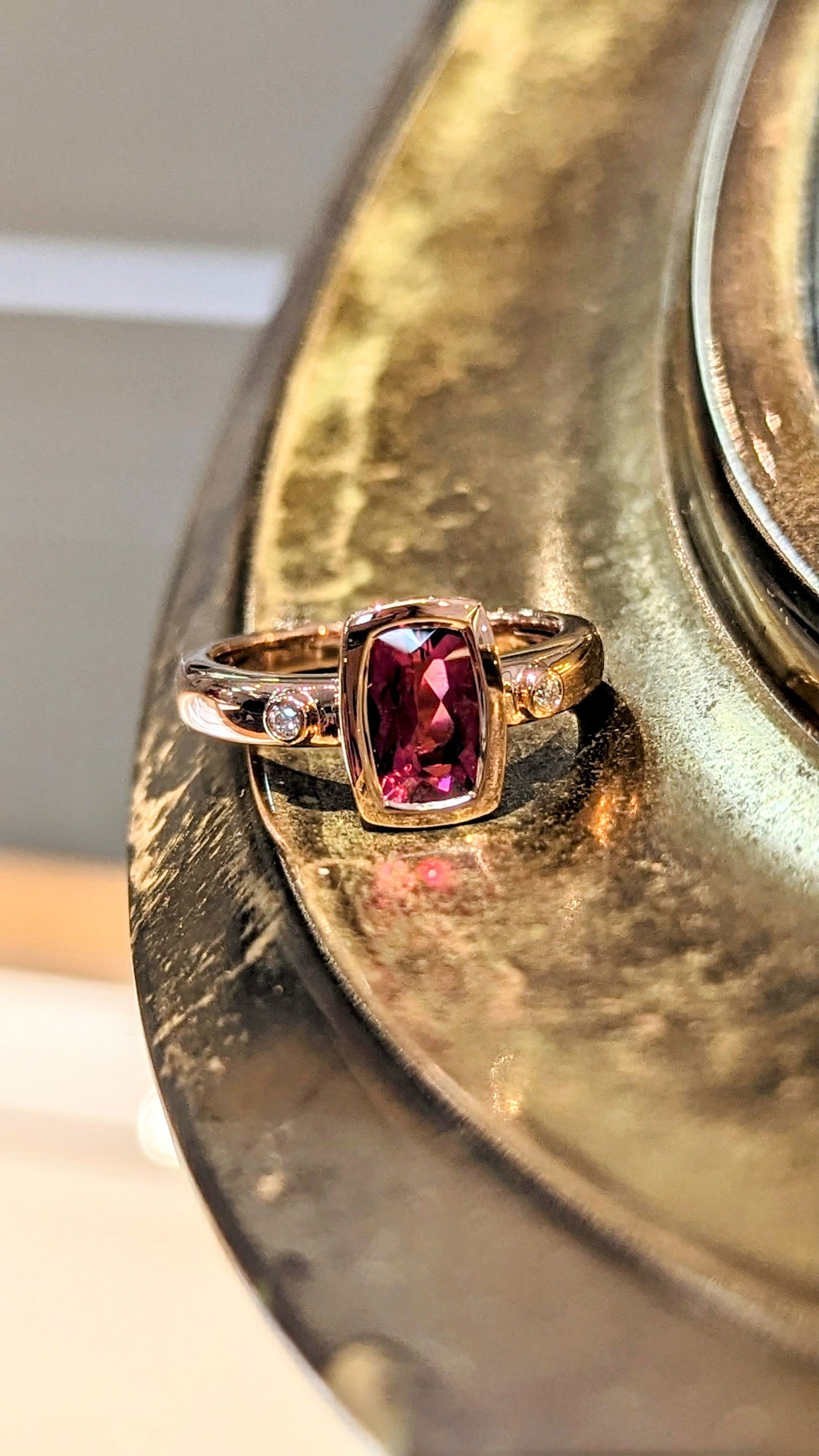 Photo of Rubellite Ring in a decorative scene, designed by , available at Plumb Gold & Plumb Silver
