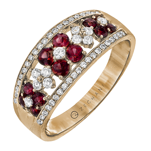 Photo of Ruby Flower Ring in a decorative scene, designed by , available at Plumb Gold & Plumb Silver