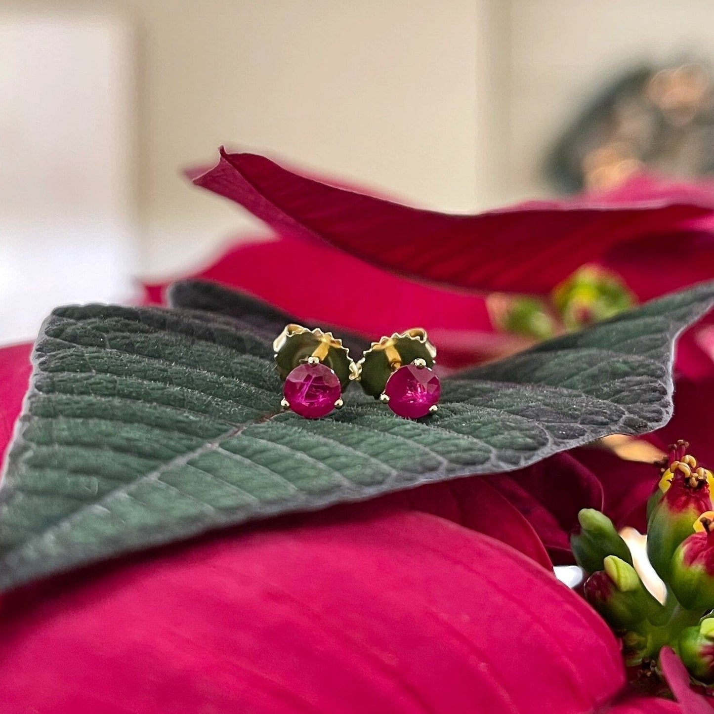 Photo of Ruby Studs in a decorative scene, designed by -, available at Plumb Gold & Plumb Silver