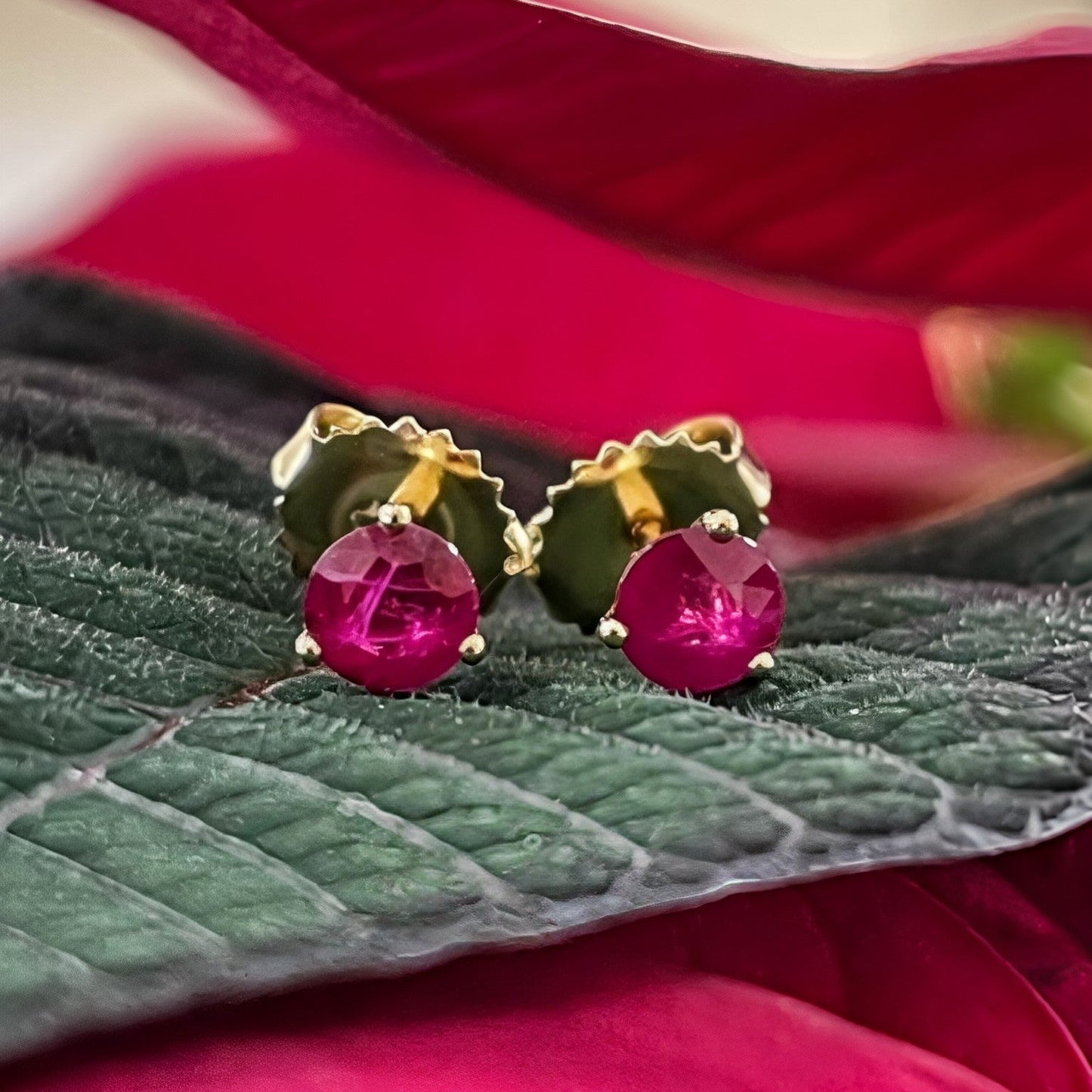 Photo of Ruby Studs in a decorative scene, designed by -, available at Plumb Gold & Plumb Silver