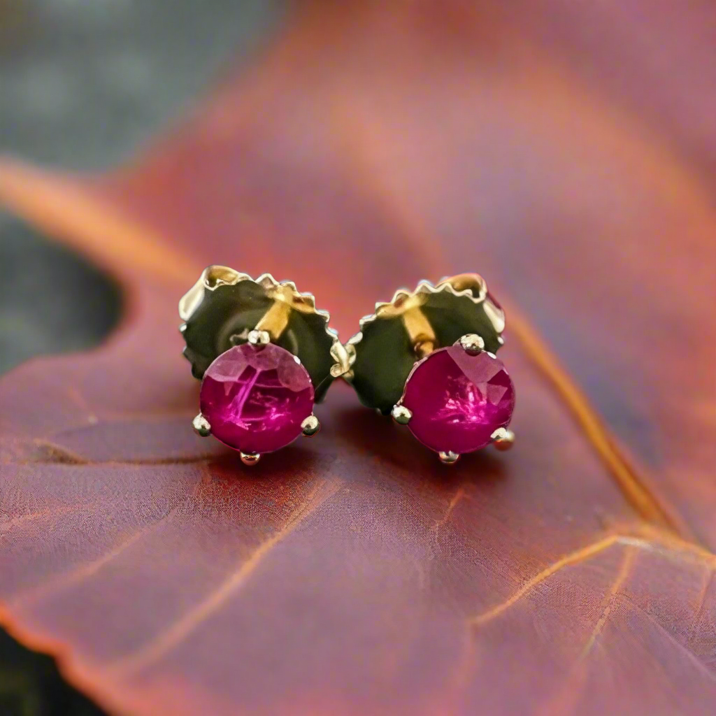 Photo of Ruby Studs in a decorative scene, designed by -, available at Plumb Gold & Plumb Silver