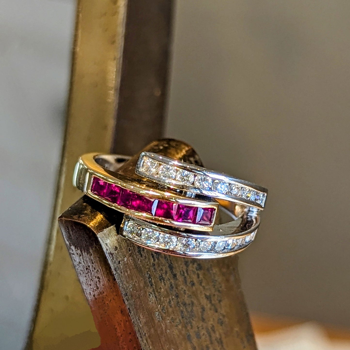 Photo of Ruby Wrap Ring in a decorative scene, designed by , available at Plumb Gold & Plumb Silver