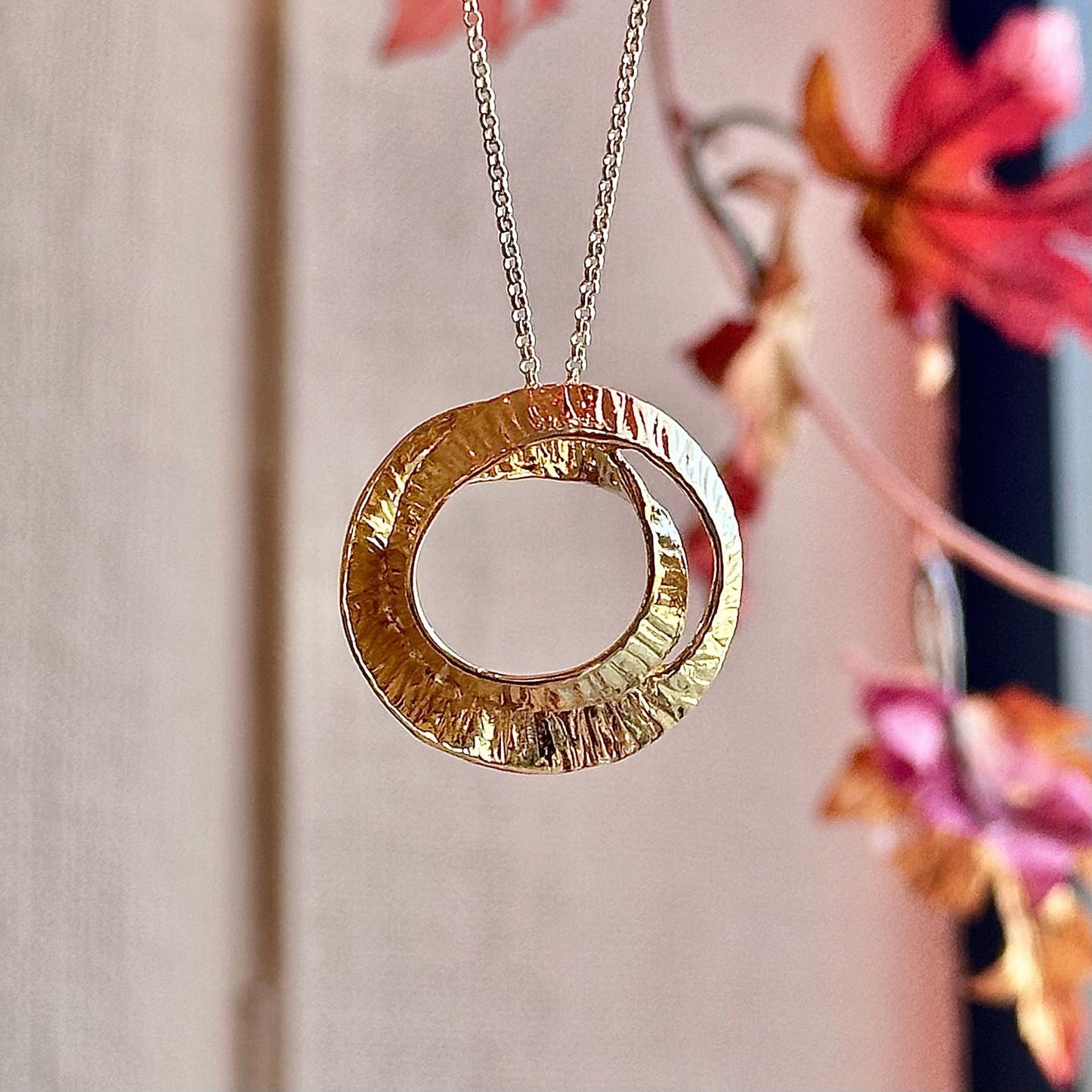 Photo of "Seaweed" Pendant in a decorative scene, designed by -, available at Plumb Gold & Plumb Silver