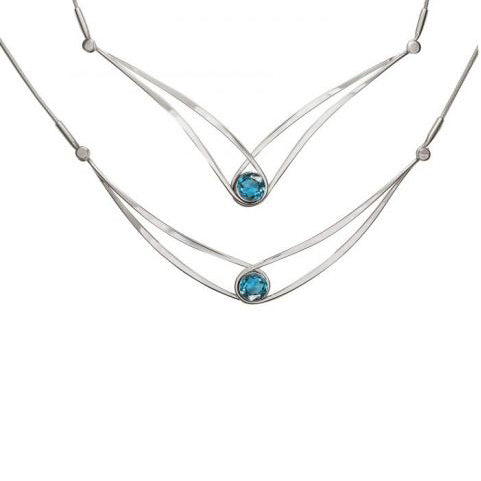 Photo of "Sensational Swing" Necklace in a decorative scene, designed by , available at Plumb Gold & Plumb Silver