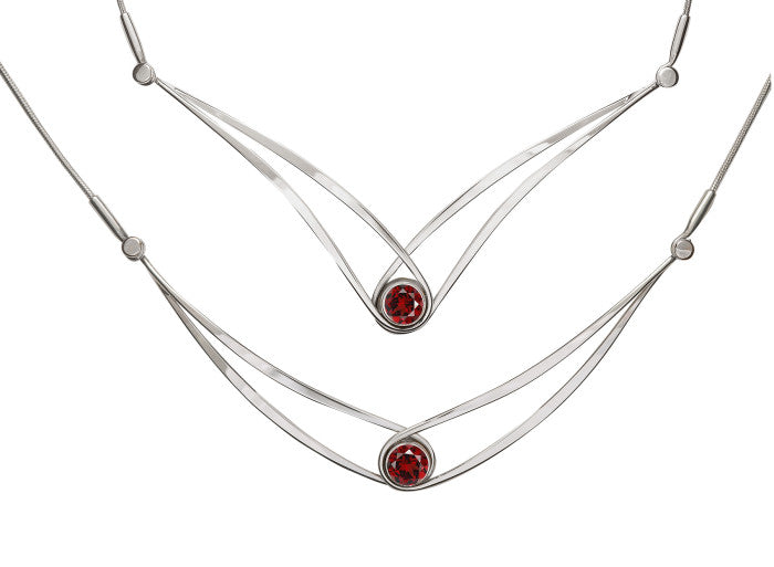 Photo of "Sensational Swing" Necklace in a decorative scene, designed by , available at Plumb Gold & Plumb Silver