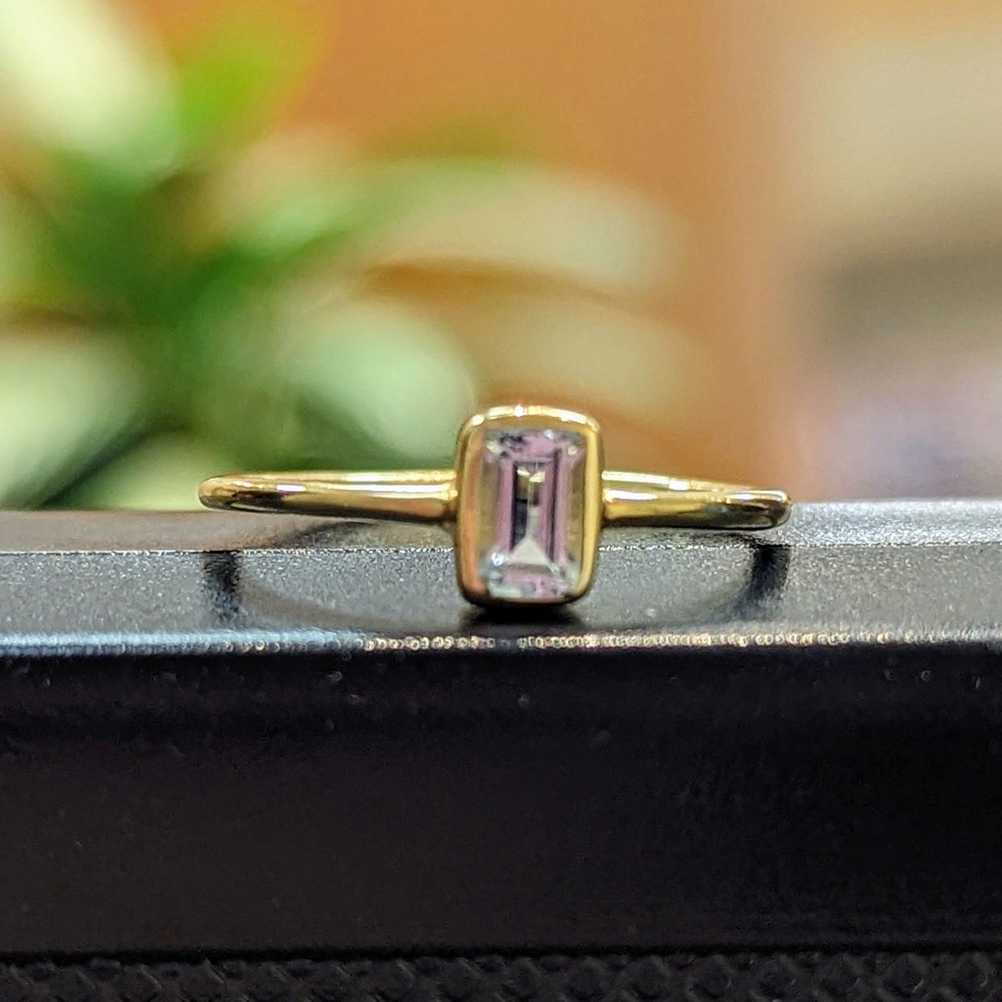 Photo of "Shade" Ring in a decorative scene, designed by , available at Plumb Gold & Plumb Silver