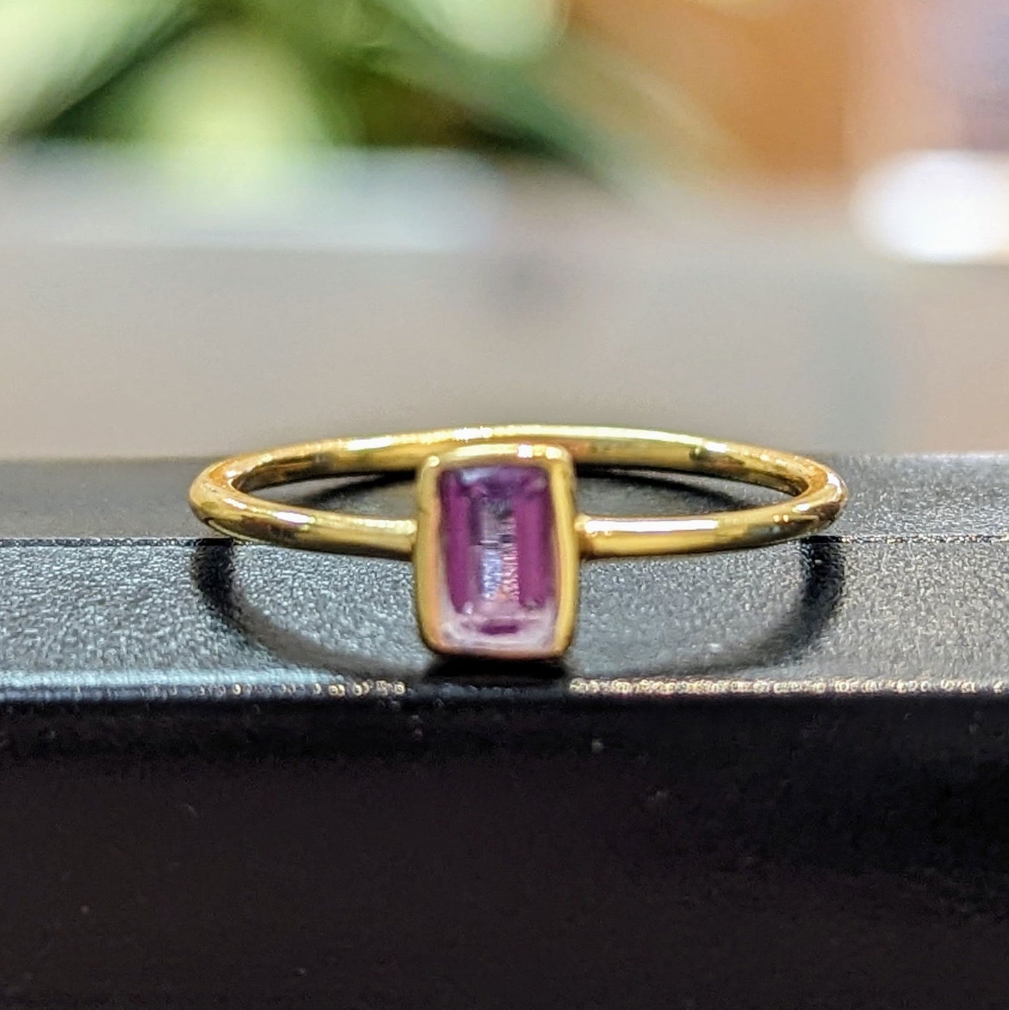Photo of "Shade" Ring in a decorative scene, designed by , available at Plumb Gold & Plumb Silver