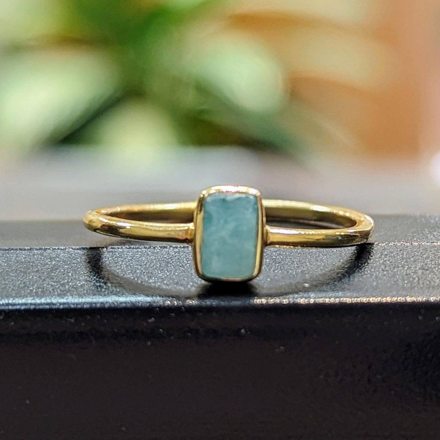 Photo of "Shade" Ring in a decorative scene, designed by , available at Plumb Gold & Plumb Silver