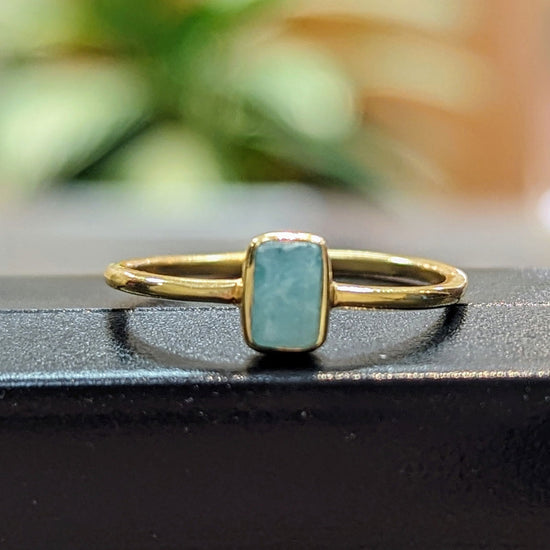 Photo of "Shade" Ring in a decorative scene, designed by , available at Plumb Gold & Plumb Silver
