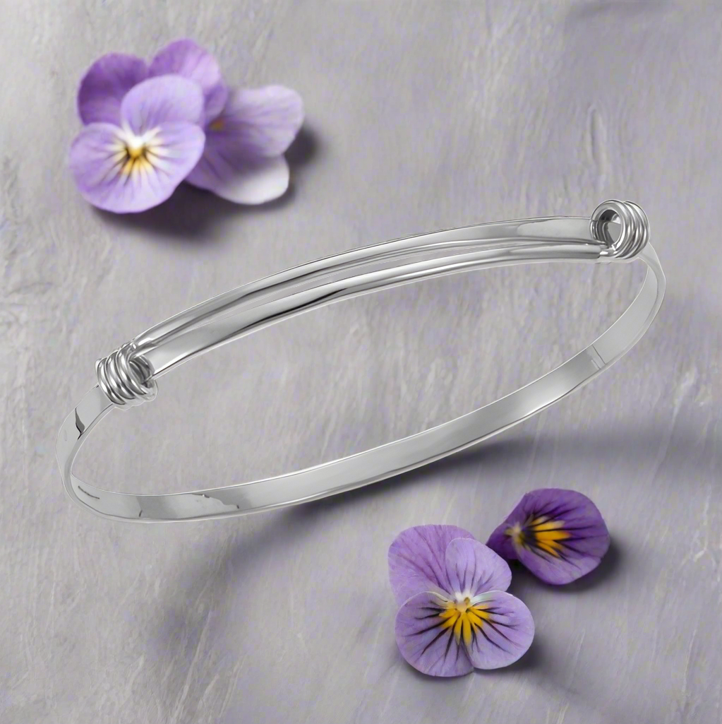 Photo of "Signature" Bracelet in a decorative scene, designed by , available at Plumb Gold & Plumb Silver