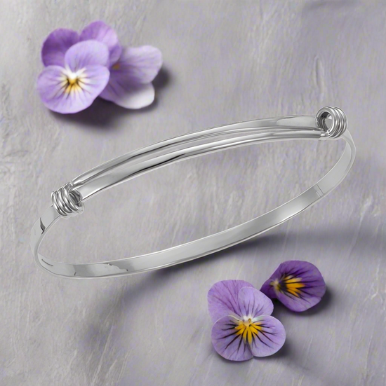 Photo of "Signature" Bracelet in a decorative scene, designed by , available at Plumb Gold & Plumb Silver