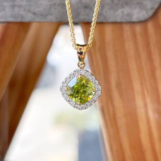 Photo of Sphene Diamond Pendant in a decorative scene, designed by , available at Plumb Gold & Plumb Silver