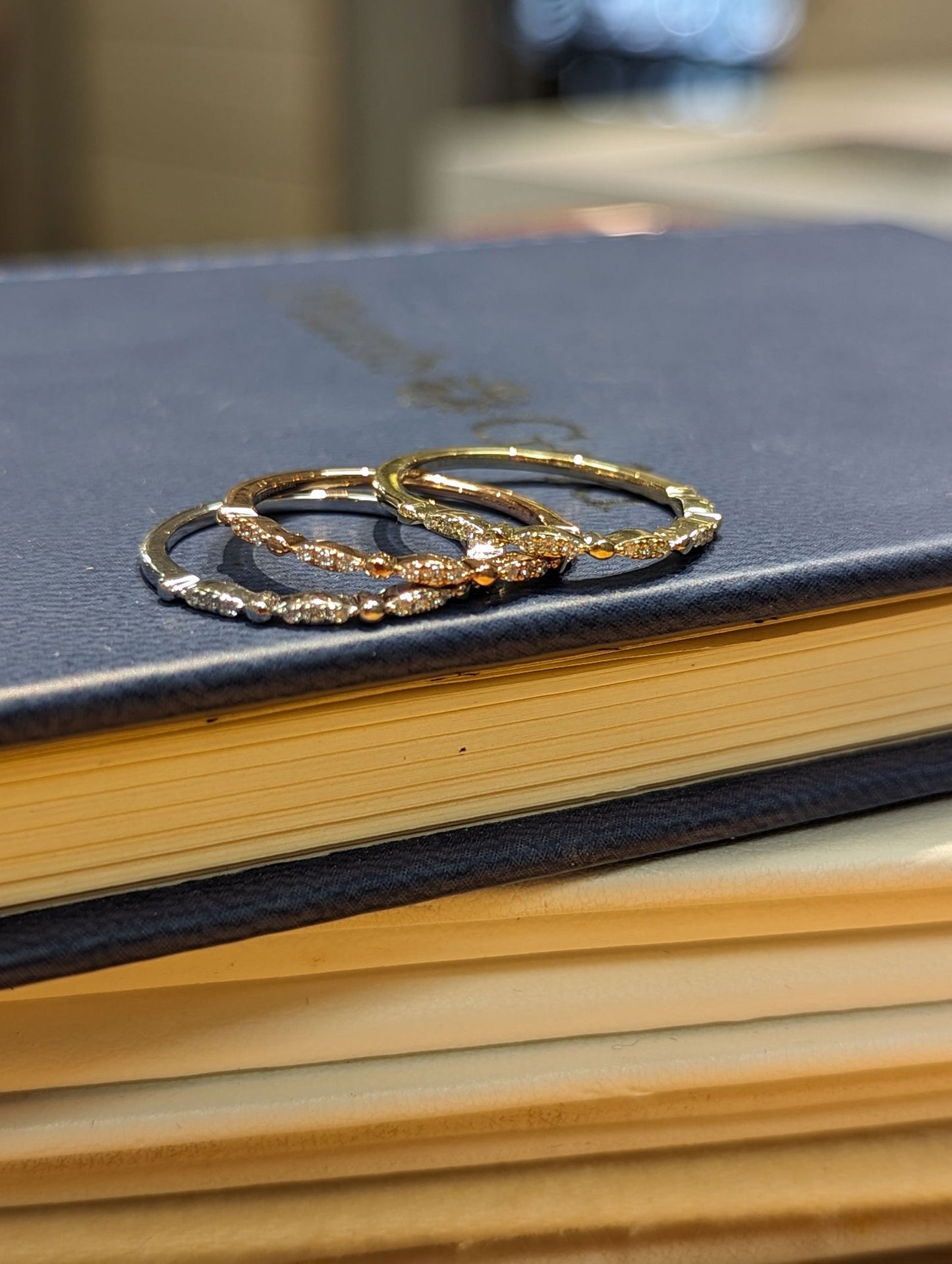 Photo of Stackable Rings in a decorative scene, designed by , available at Plumb Gold & Plumb Silver