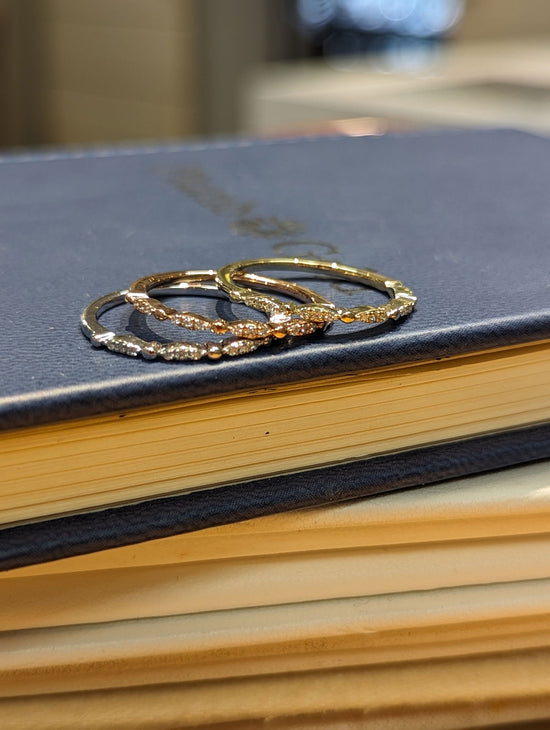 Photo of Stackable Rings in a decorative scene, designed by , available at Plumb Gold & Plumb Silver