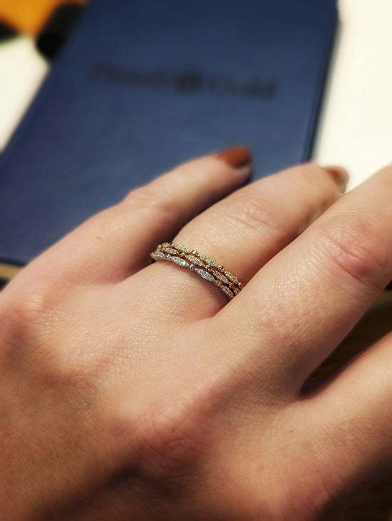Photo of Stackable Rings in a decorative scene, designed by , available at Plumb Gold & Plumb Silver