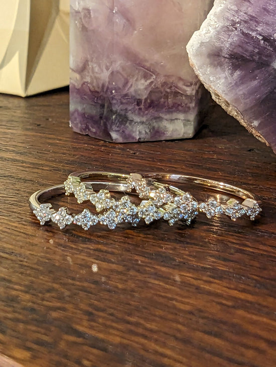 Photo of Stackable Rings in a decorative scene, designed by , available at Plumb Gold & Plumb Silver