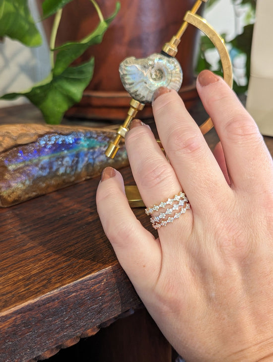 Photo of Stackable Rings in a decorative scene, designed by , available at Plumb Gold & Plumb Silver
