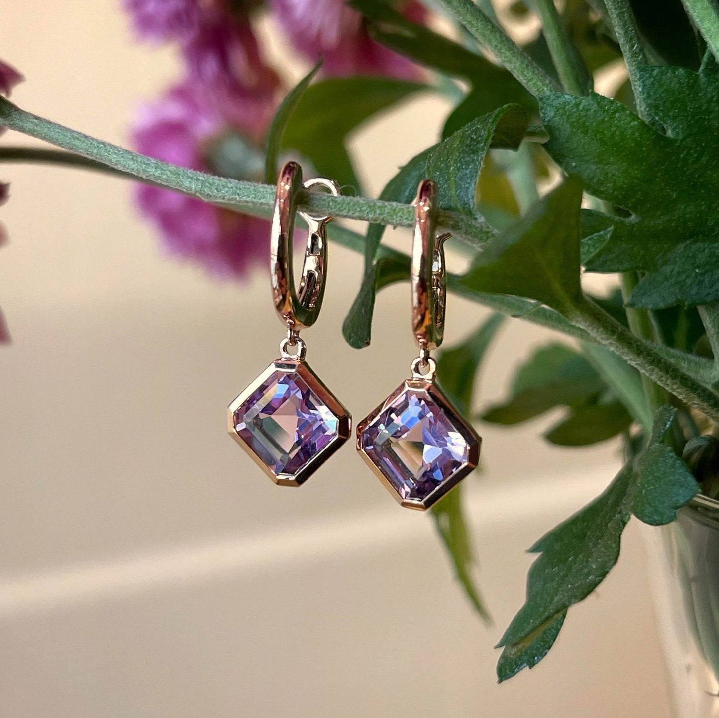 Photo of Stanton Color Lavender Amethyst Dangles in a decorative scene, designed by , available at Plumb Gold & Plumb Silver