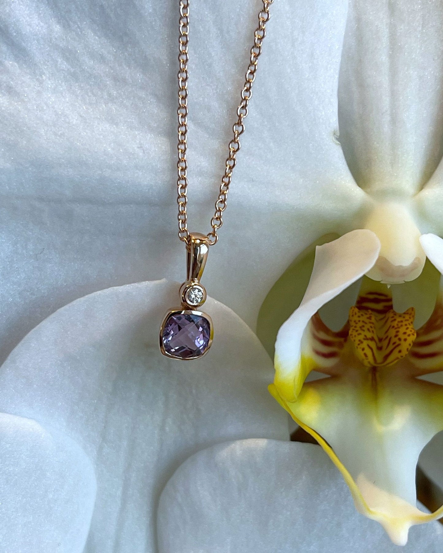 Photo of Stanton Color Lavender Amethyst Necklace in a decorative scene, designed by , available at Plumb Gold & Plumb Silver