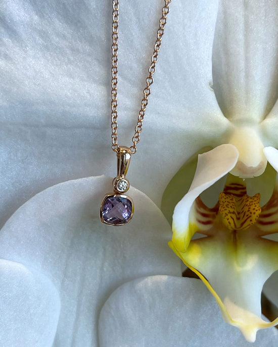 Photo of Stanton Color Lavender Amethyst Necklace in a decorative scene, designed by , available at Plumb Gold & Plumb Silver