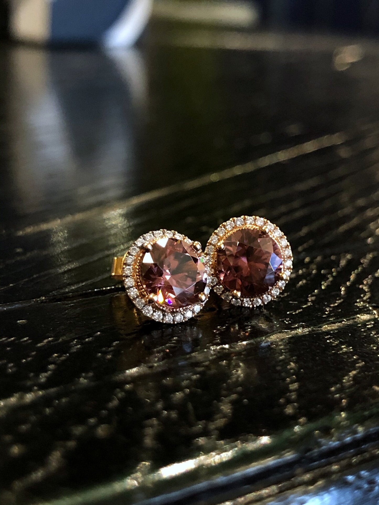 Photo of Stanton Color Pink Zircon Studs in a decorative scene, designed by , available at Plumb Gold & Plumb Silver