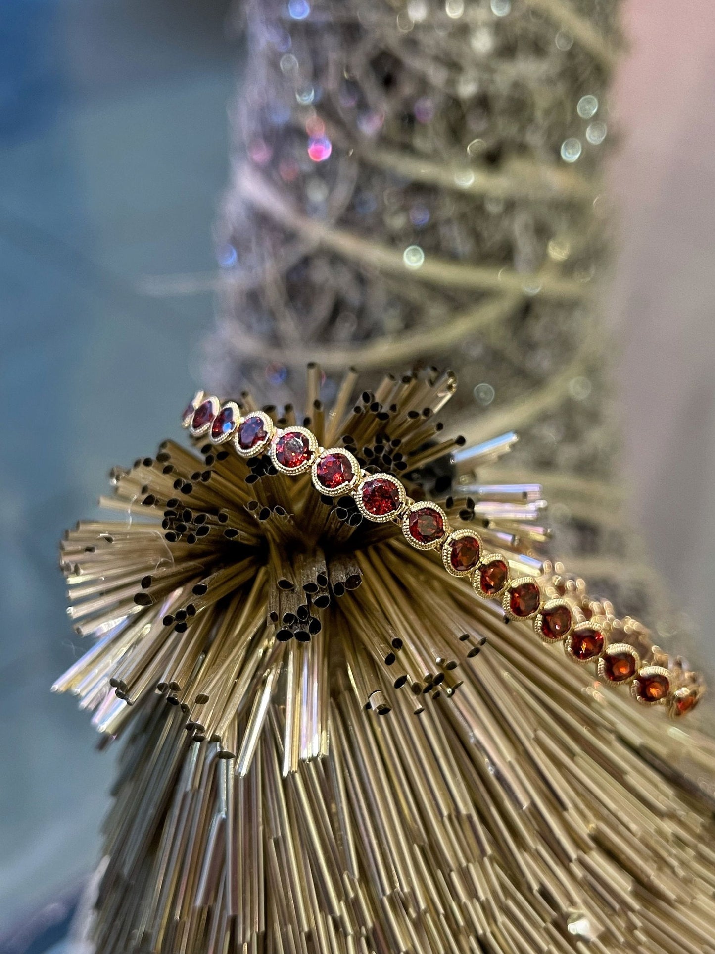 Photo of Stanton Color Red Garnet Bracelet in a decorative scene, designed by , available at Plumb Gold & Plumb Silver