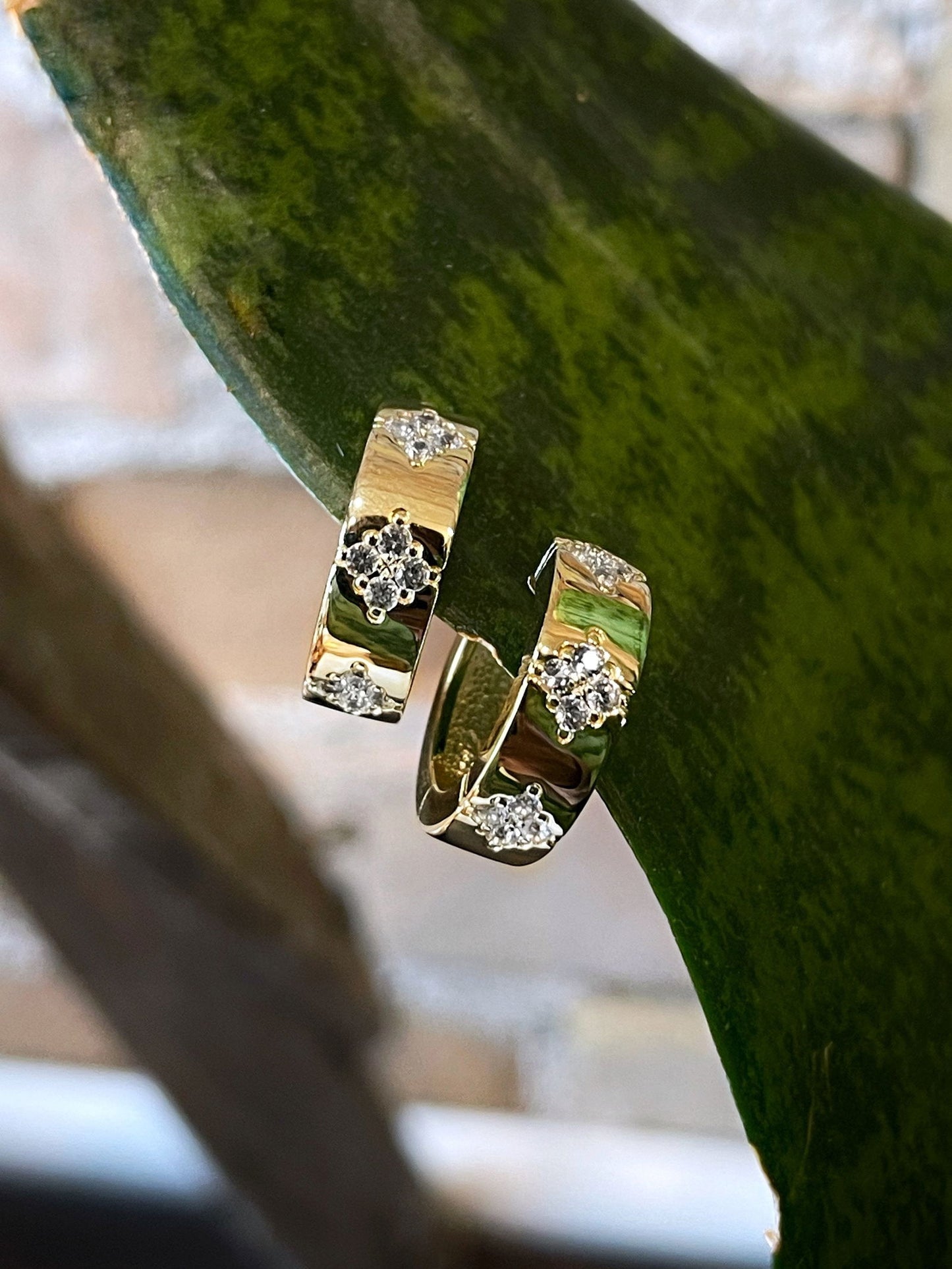 Photo of Starburst Huggies in a decorative scene, designed by , available at Plumb Gold & Plumb Silver