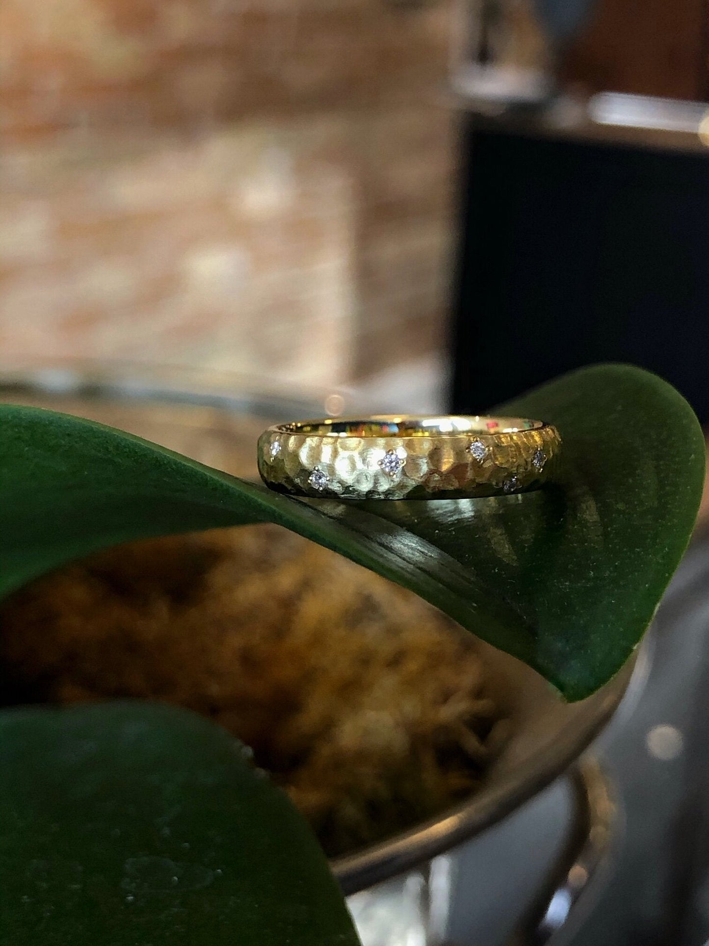 Photo of "Stardust" Band in a decorative scene, designed by , available at Plumb Gold & Plumb Silver