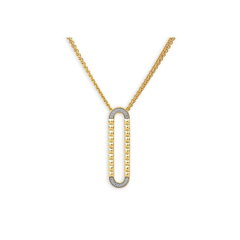 Photo of Studded Oval Pendant in a decorative scene, designed by , available at Plumb Gold & Plumb Silver