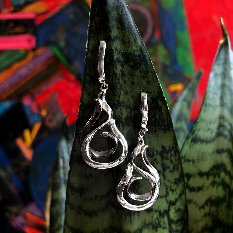 Photo of "Swing" Dangle Earring in a decorative scene, designed by , available at Plumb Gold & Plumb Silver