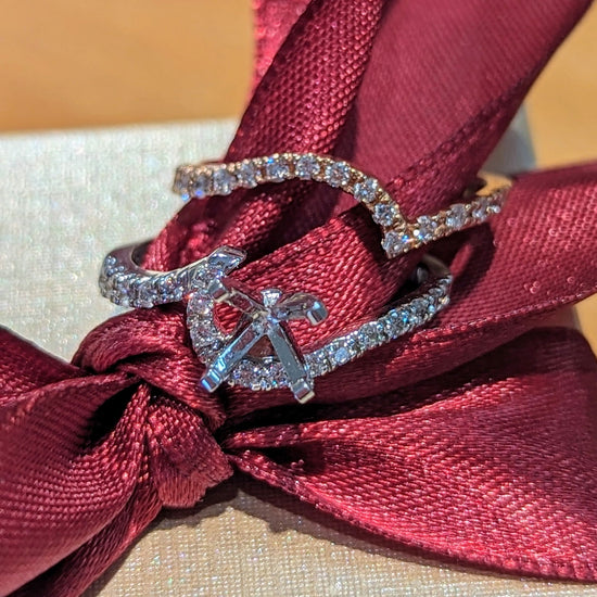 Photo of Swirl Engagement Ring Mounting in a decorative scene, designed by , available at Plumb Gold & Plumb Silver