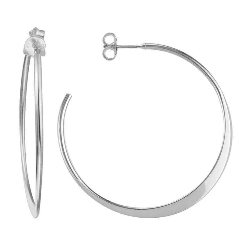 Photo of Tapered Hoops in a decorative scene, designed by , available at Plumb Gold & Plumb Silver
