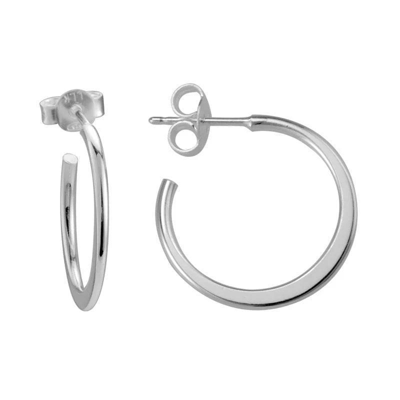 Photo of Tapered Hoops in a decorative scene, designed by , available at Plumb Gold & Plumb Silver