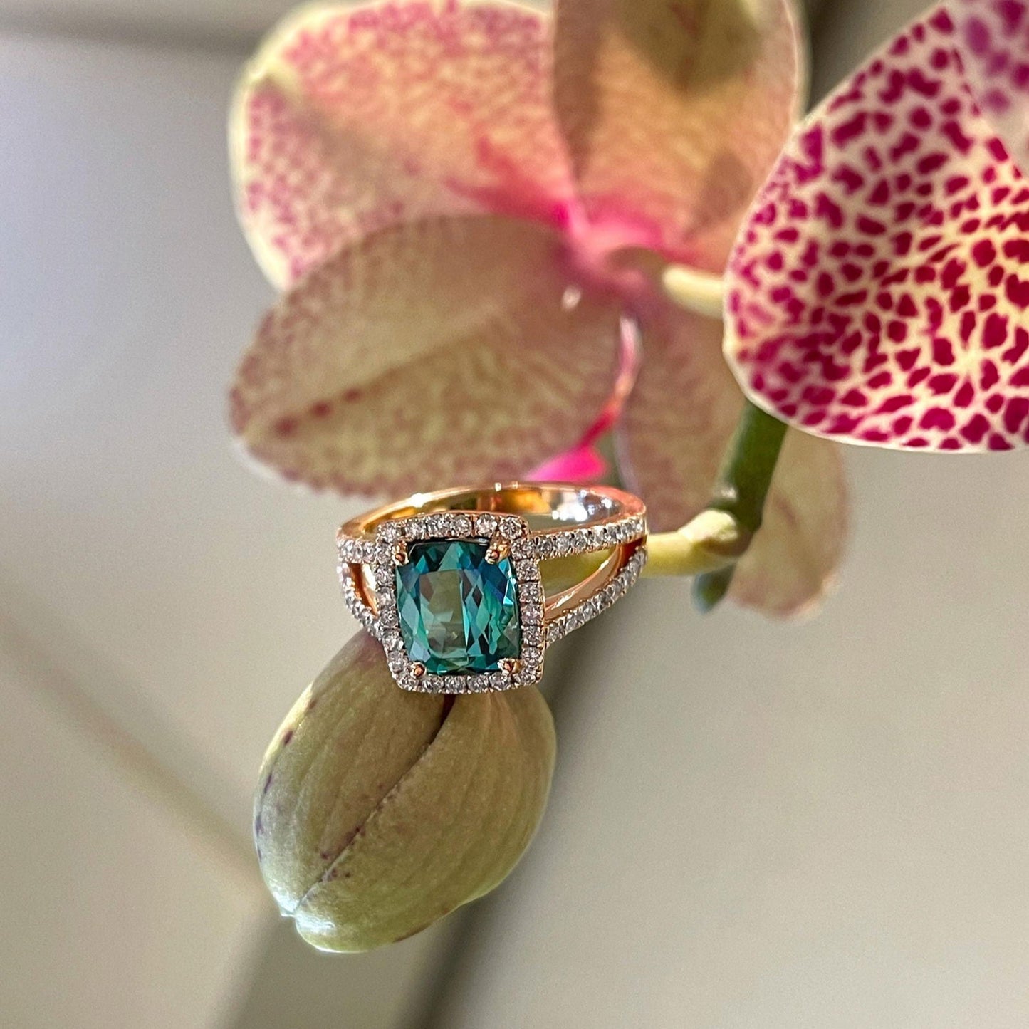 Photo of Teal Tourmaline Ring in a decorative scene, designed by , available at Plumb Gold & Plumb Silver
