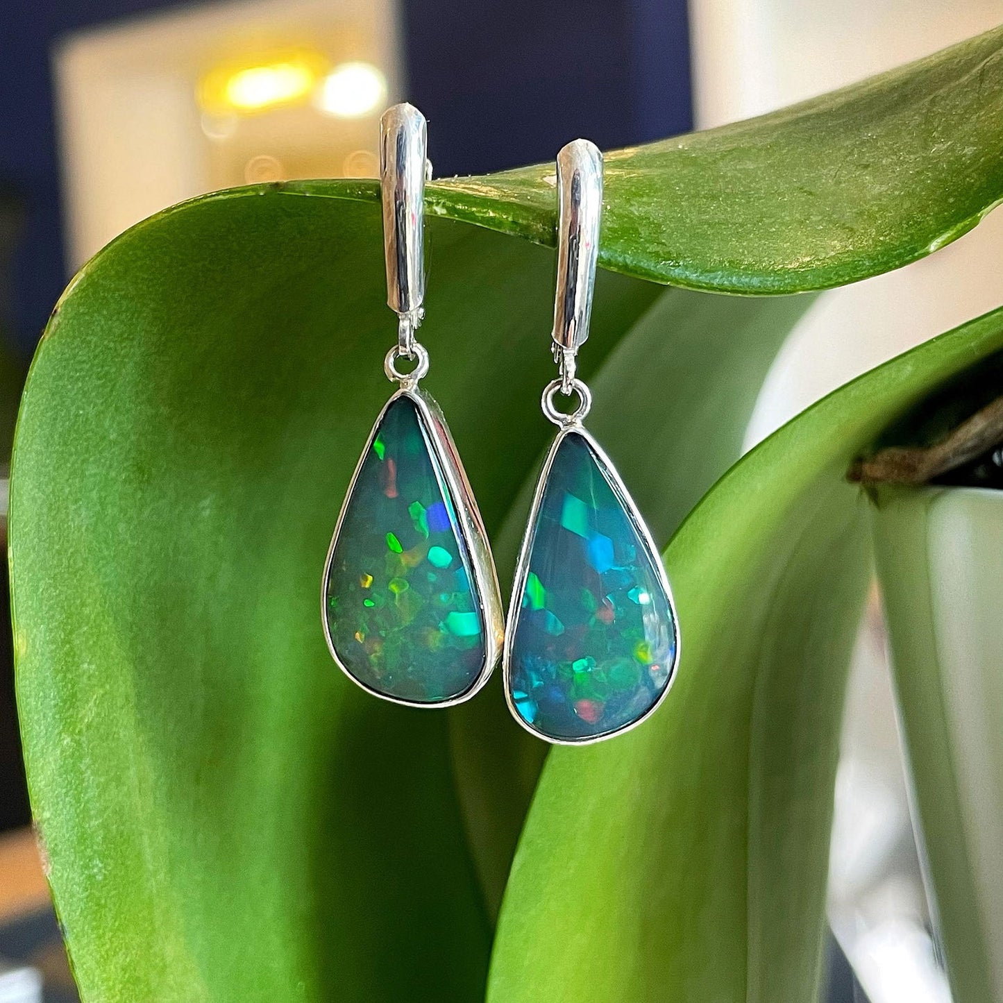 Photo of Teardrop Opal Dangles in a decorative scene, designed by , available at Plumb Gold & Plumb Silver