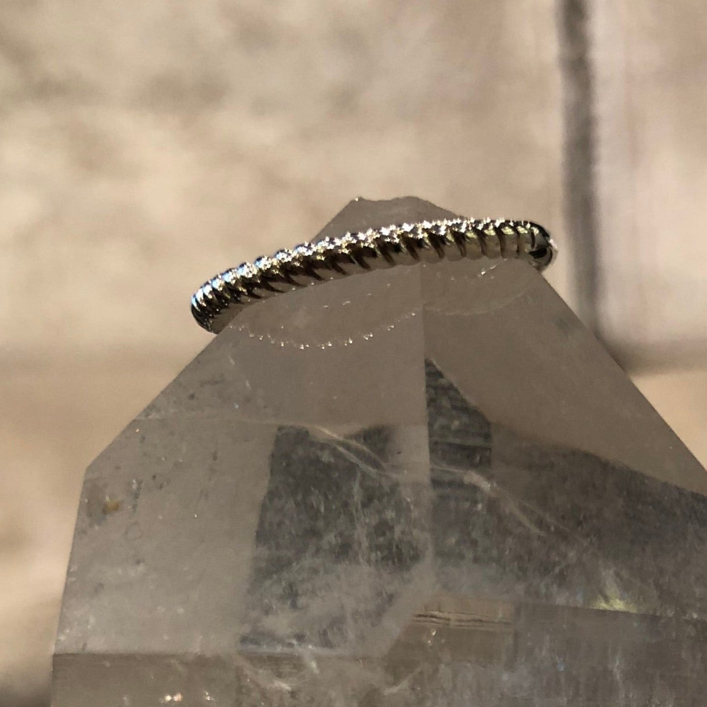 Photo of Ti Sento Sterling Silver Rope Ring in a decorative scene, designed by , available at Plumb Gold & Plumb Silver